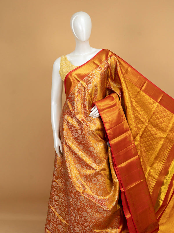 Mustard gold pure Kanchipuram silk saree with floral zari jaal body and contrast red gold zari border