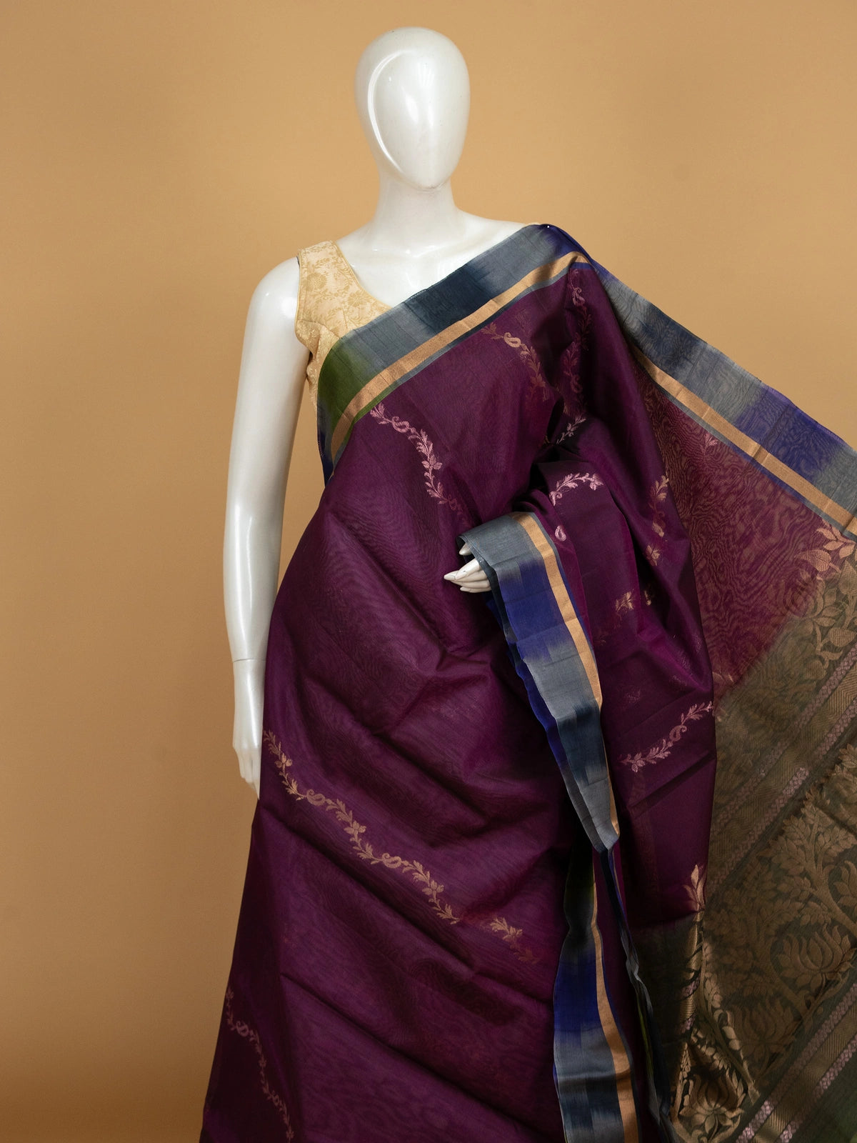 Purple pure silk cotton saree with green contrast zari border and floral lotus pallu