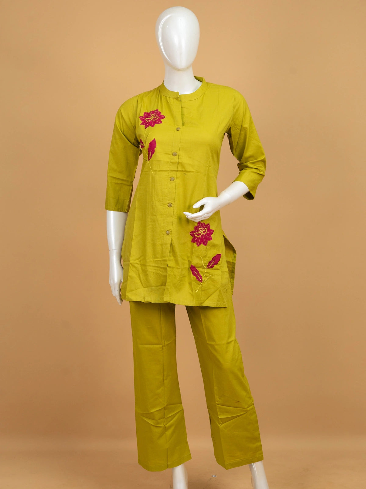 Lime green cotton co-ord kurti set with contrast pink floral embroidery and matching straight pants