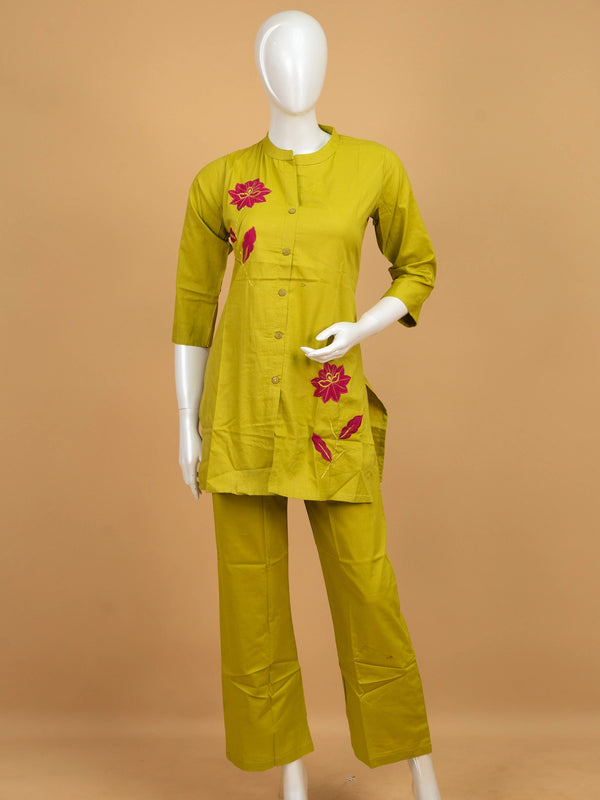 Lime green cotton co-ord kurti set with contrast pink floral embroidery and matching straight pants