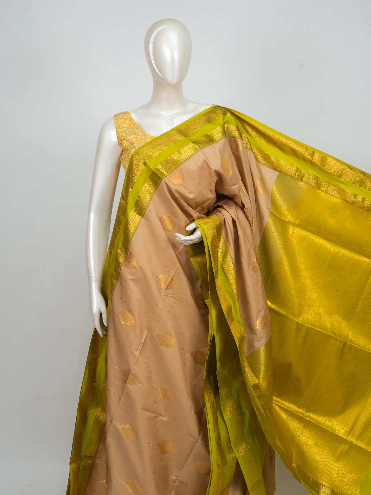 Beige semi silk saree with lime green gold zari contrast border and zari pallu