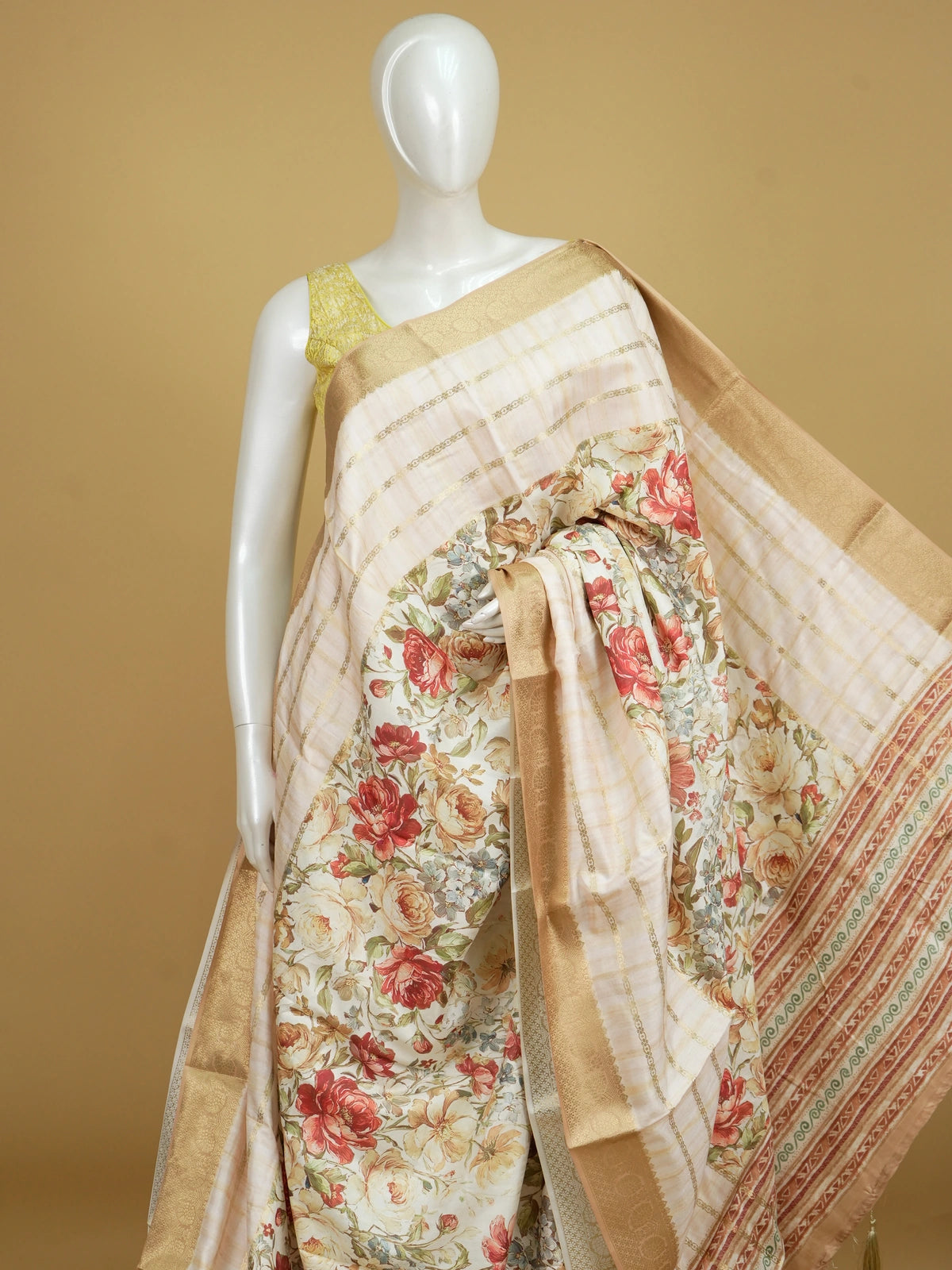 Cream floral print Dola silk saree with gold zari stripes and contrast woven border