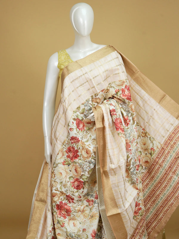 Cream floral print Dola silk saree with gold zari stripes and contrast woven border