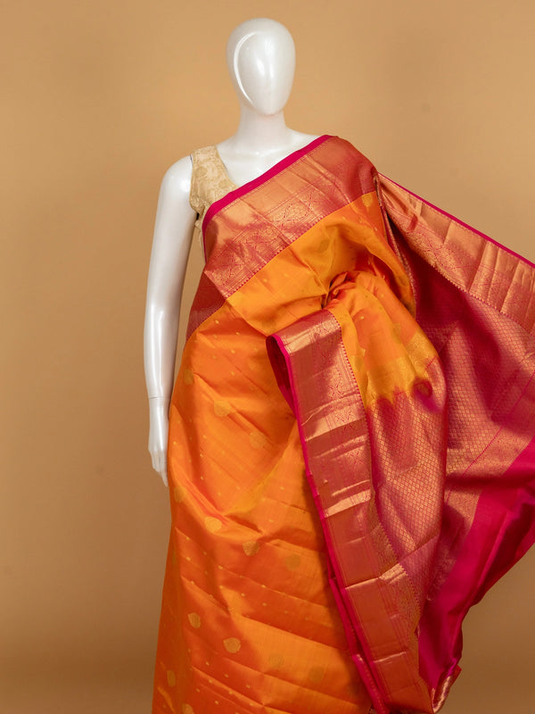 Orange and pink pure Kanchipuram silk saree with gold zari border and zari pallu