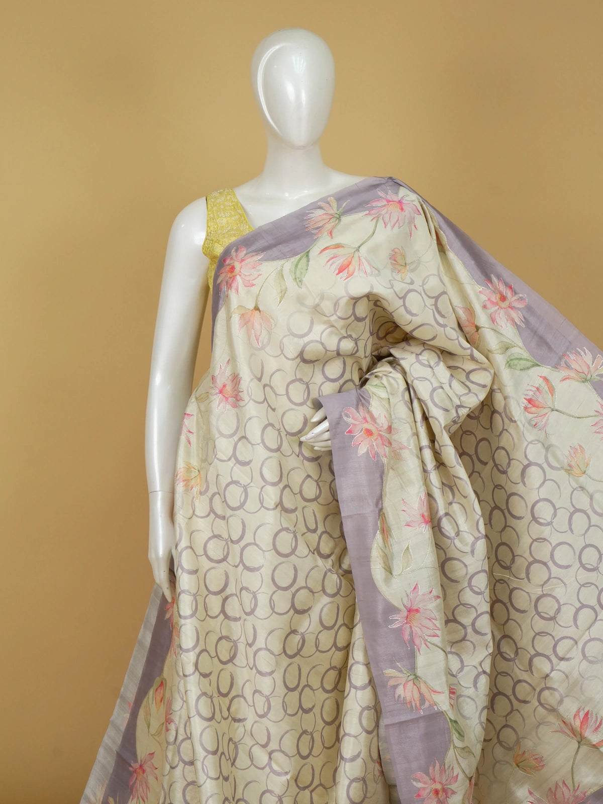 Cream and lavender designer silk saree with hand-painted lotus florals and silver thread work