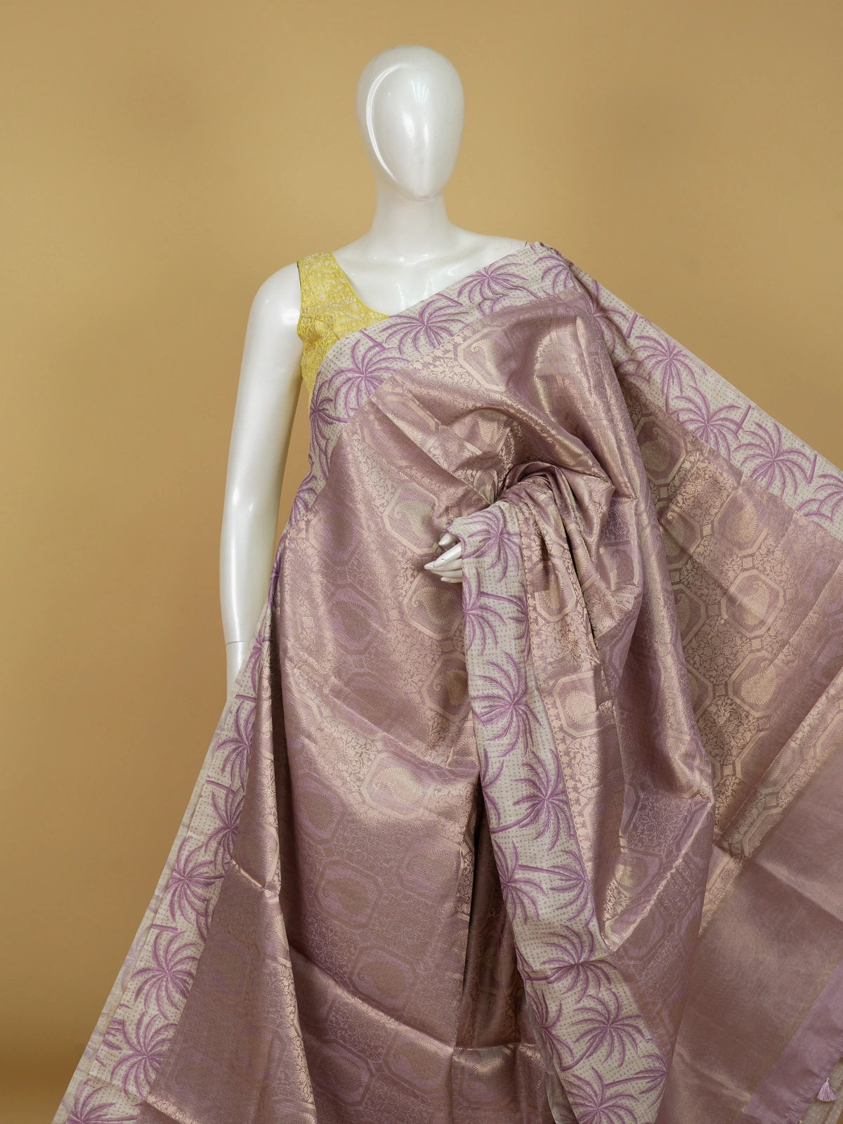 Mauve designer tissue saree with gold zari paisley weave and palm-tree print border