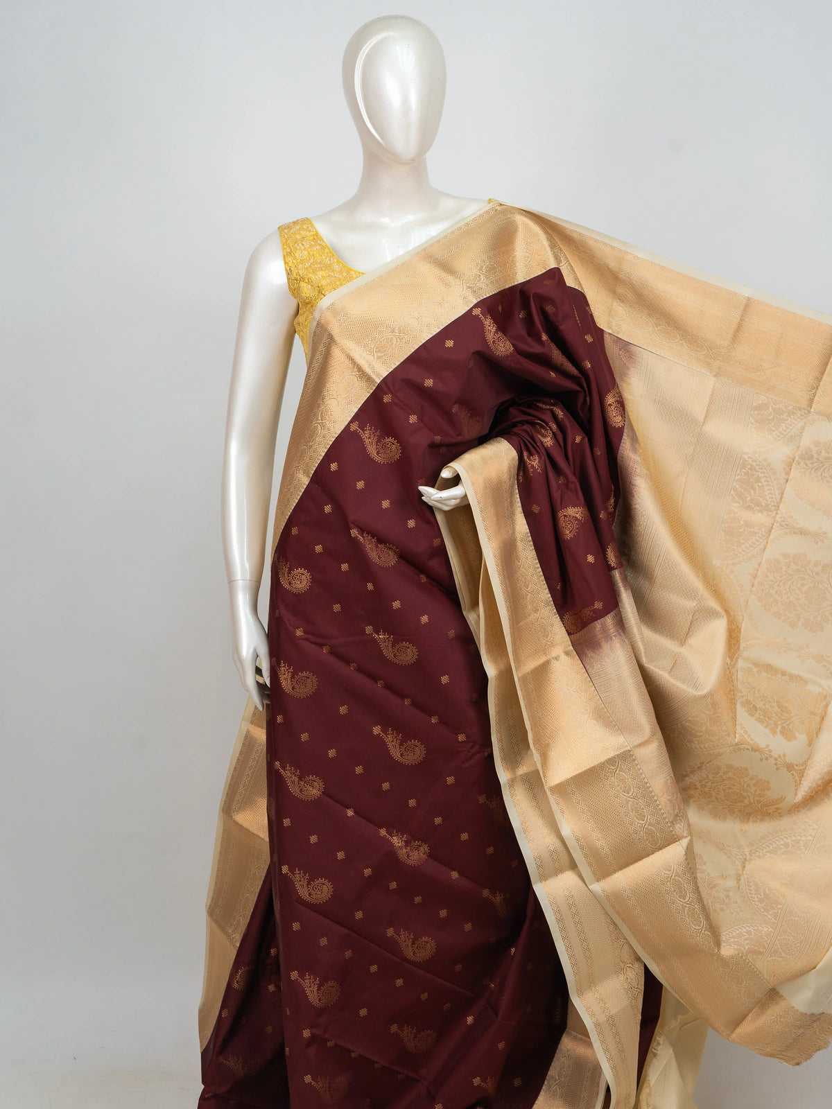 Maroon semi silk saree with gold zari paisley butis and contrast cream zari border