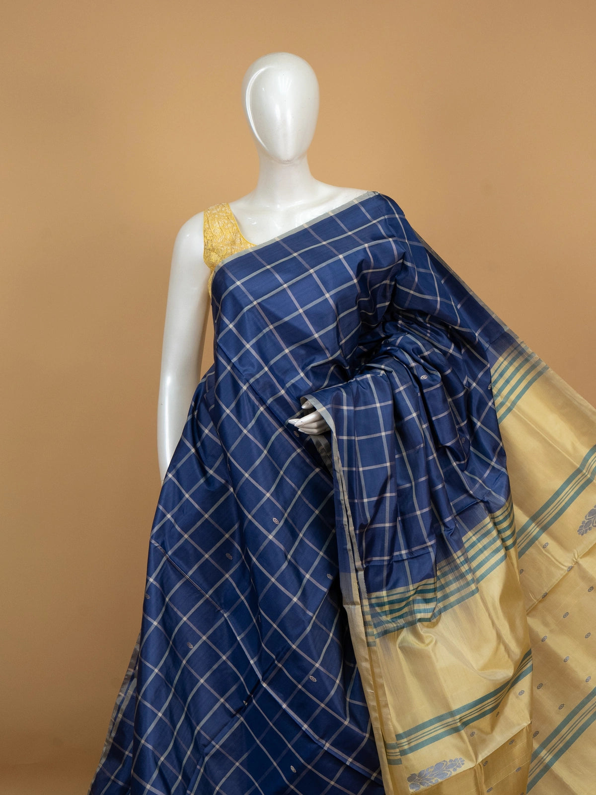 Royal blue and cream checked banana silk saree with woven butta motifs and a striped contrast pallu