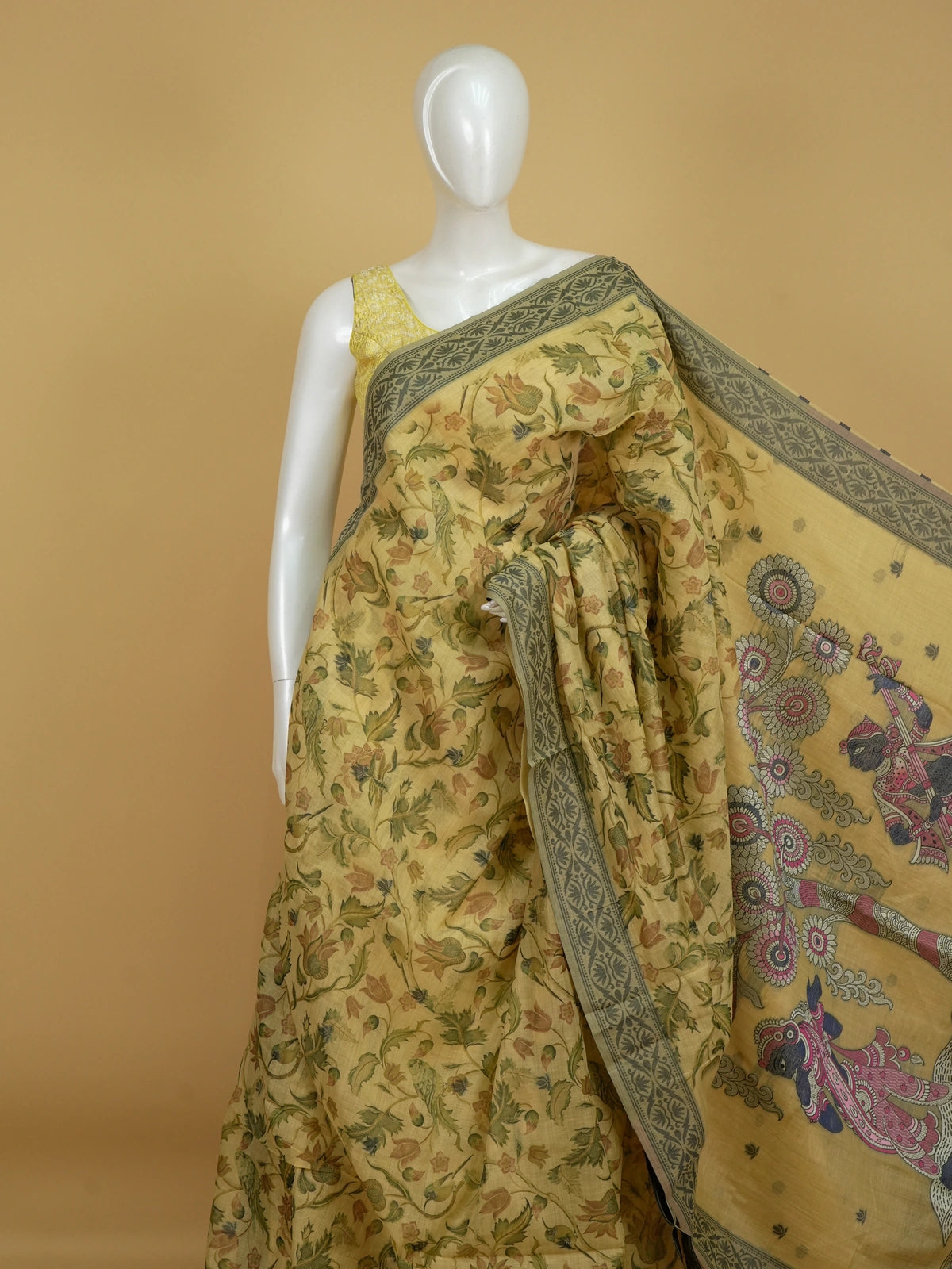 Beige linen cotton saree with floral print, grey-green border and Kalamkari-style Radha-Krishna pallu