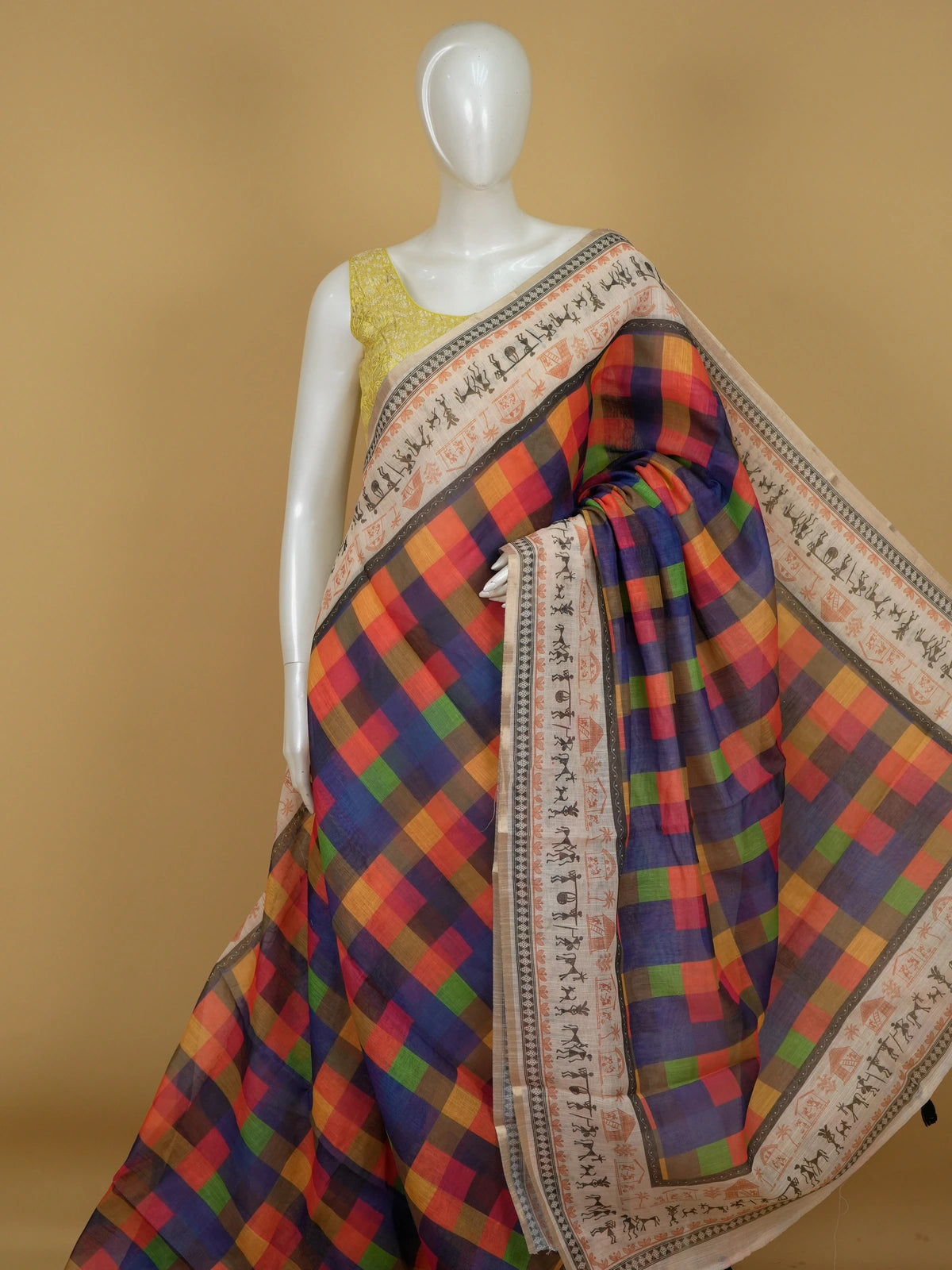 Multicolour checked linen cotton saree with Warli tribal print border and yellow blouse