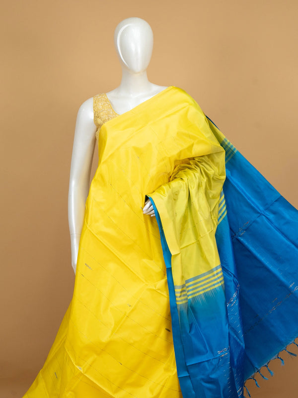 Yellow banana silk saree with contrast blue pallu, striped border and blue blouse