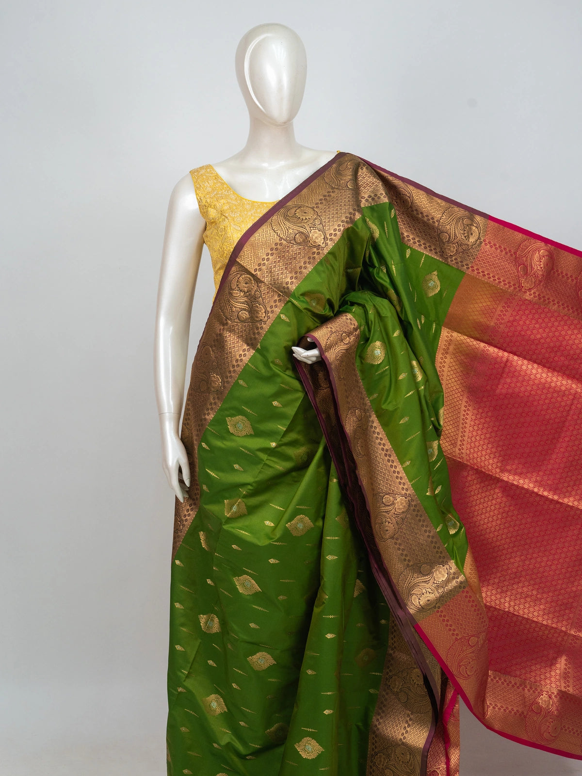 Parrot green semi silk saree with contrast pink gold zari border and floral pallu