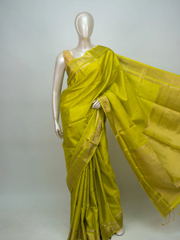 Lime green soft silk saree with broad gold zari border and ornate zari pallu
