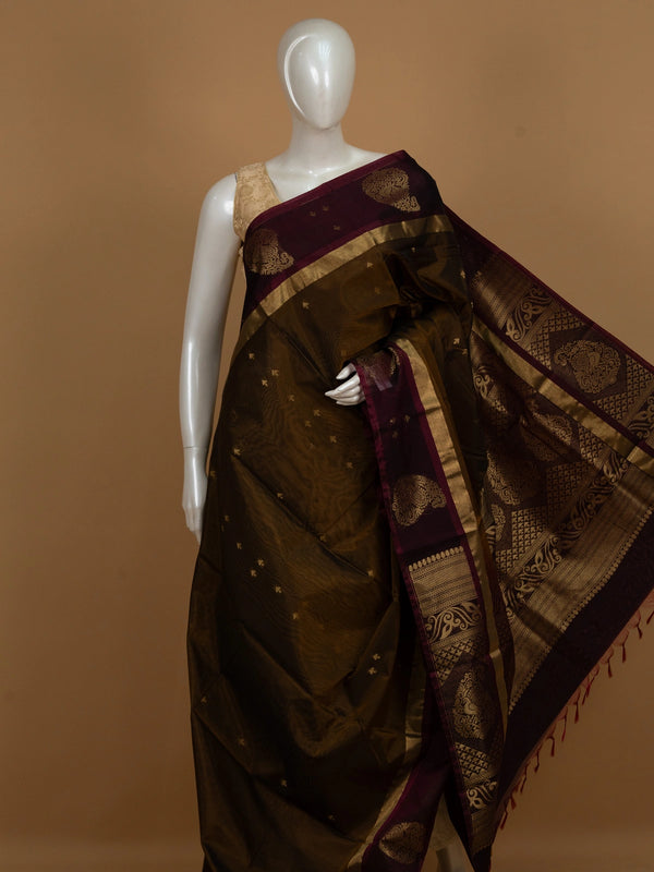Mehendi-green silk cotton saree with maroon contrast border and gold zari peacock pallu