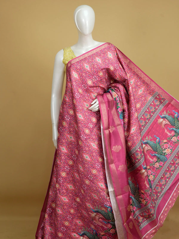 Pink Dola silk saree with patola print body, gold zari border and peacock floral pallu
