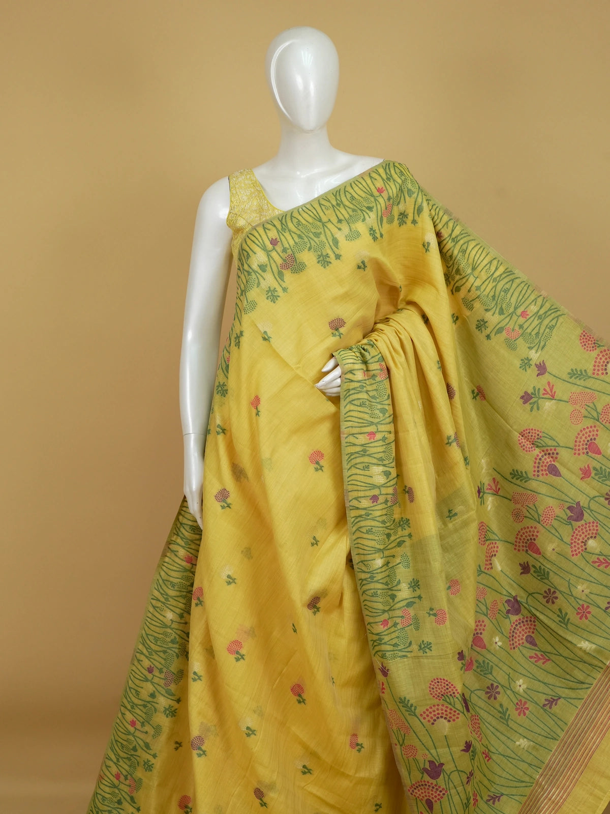 Yellow linen cotton saree with pink and purple floral motifs, floral meadow pallu and contrast green blouse