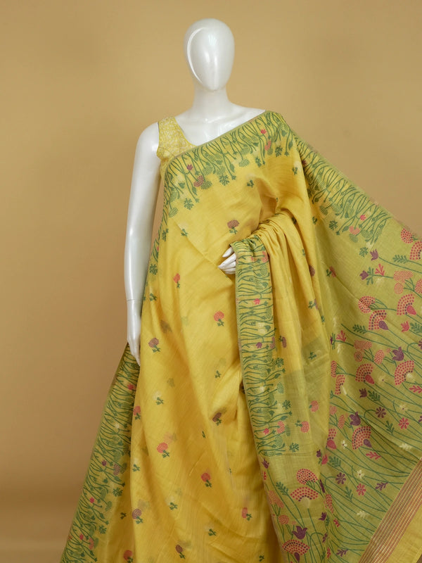 Yellow linen cotton saree with pink and purple floral motifs, floral meadow pallu and contrast green blouse