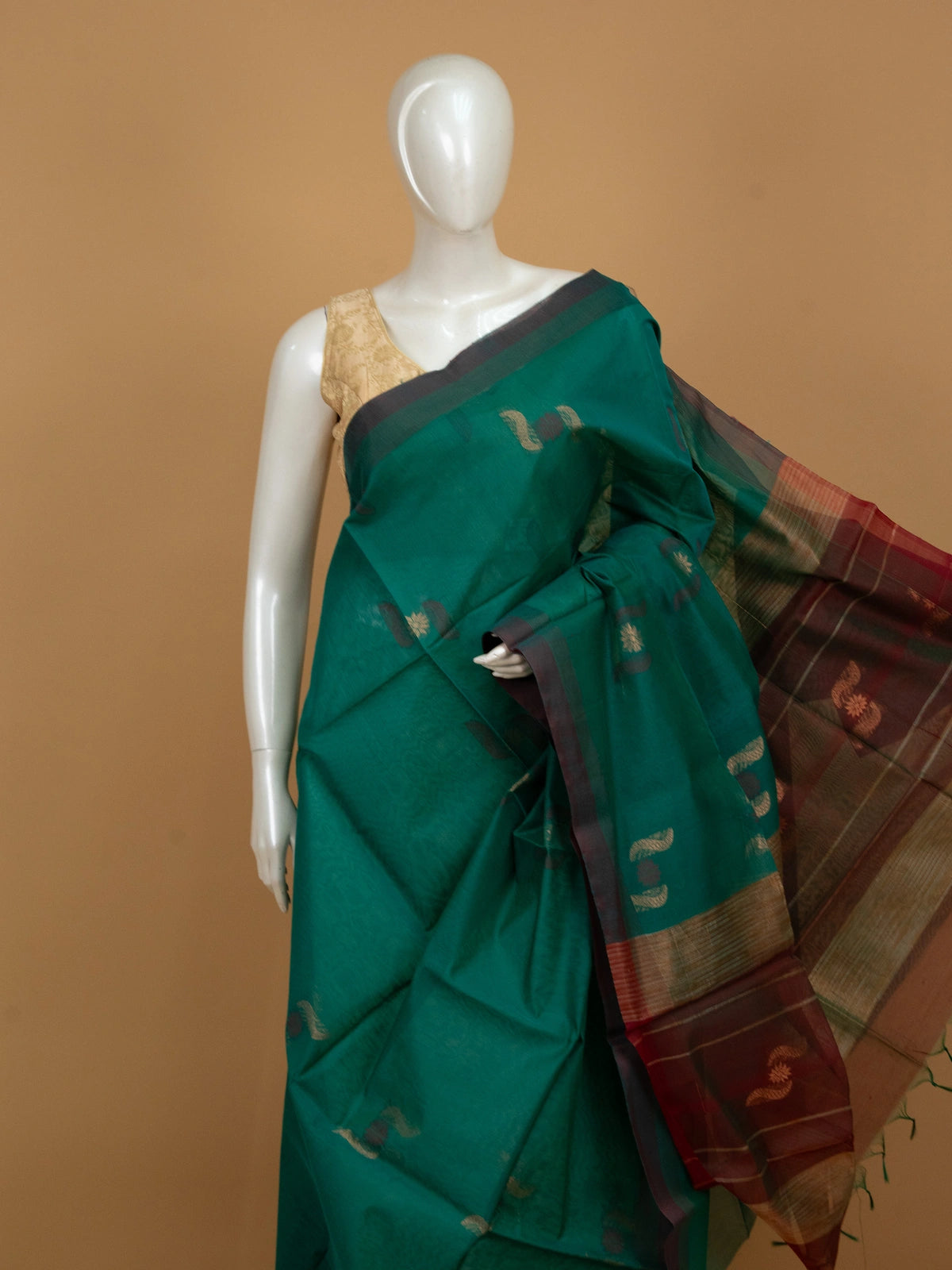 Teal green silk cotton saree with maroon gold zari border and paisley floral buttas