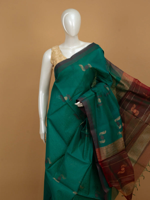 Teal green silk cotton saree with maroon gold zari border and paisley floral buttas