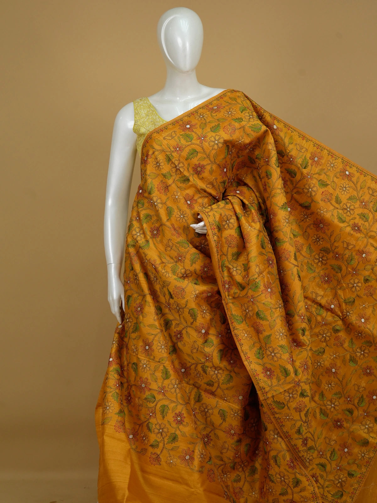 Mustard yellow semi tussar saree with allover multicolour floral embroidery and embroidered pallu