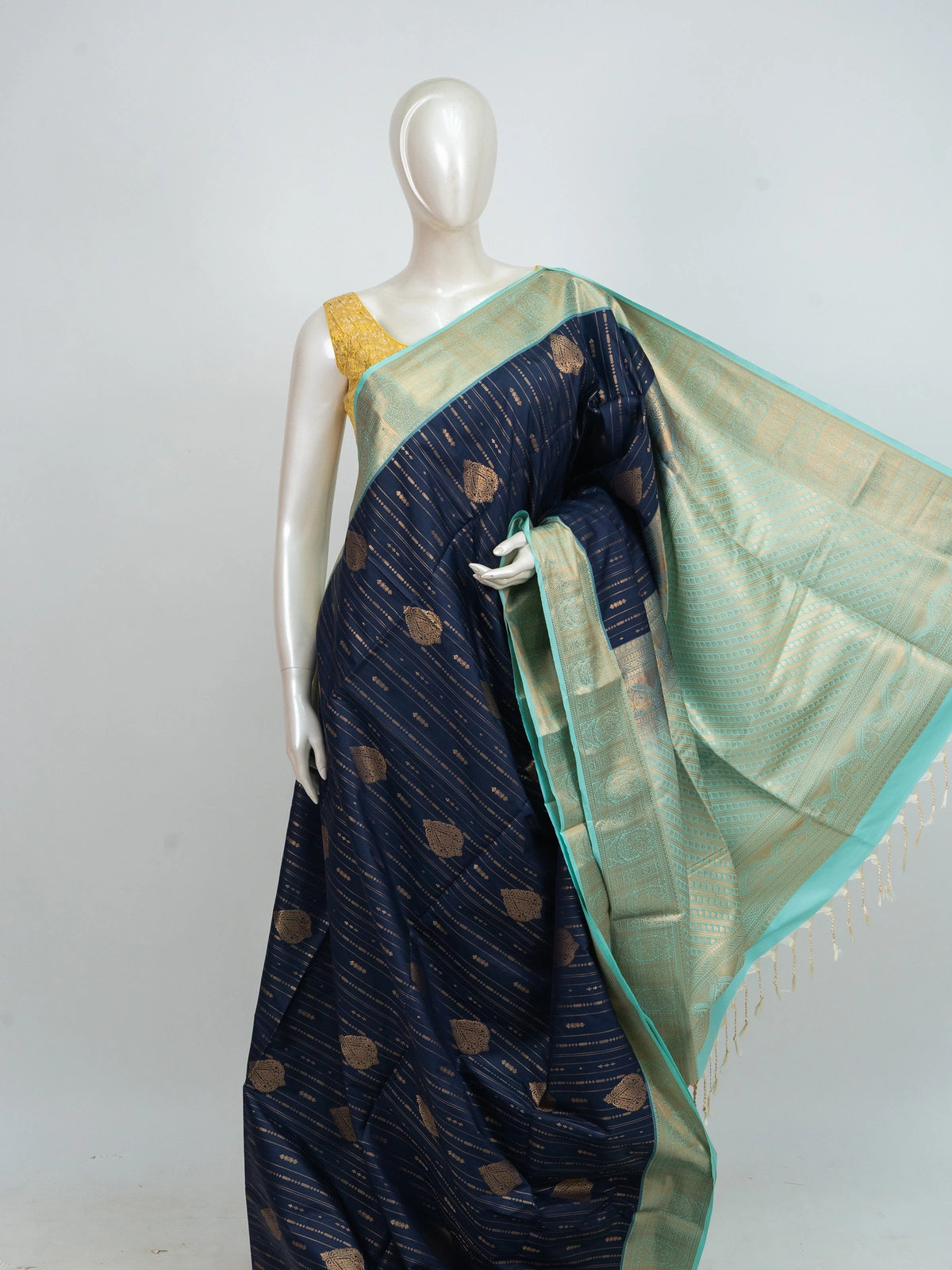 Navy blue Kanchipuram fancy silk saree with sea-green contrast zari border and gold zari motifs