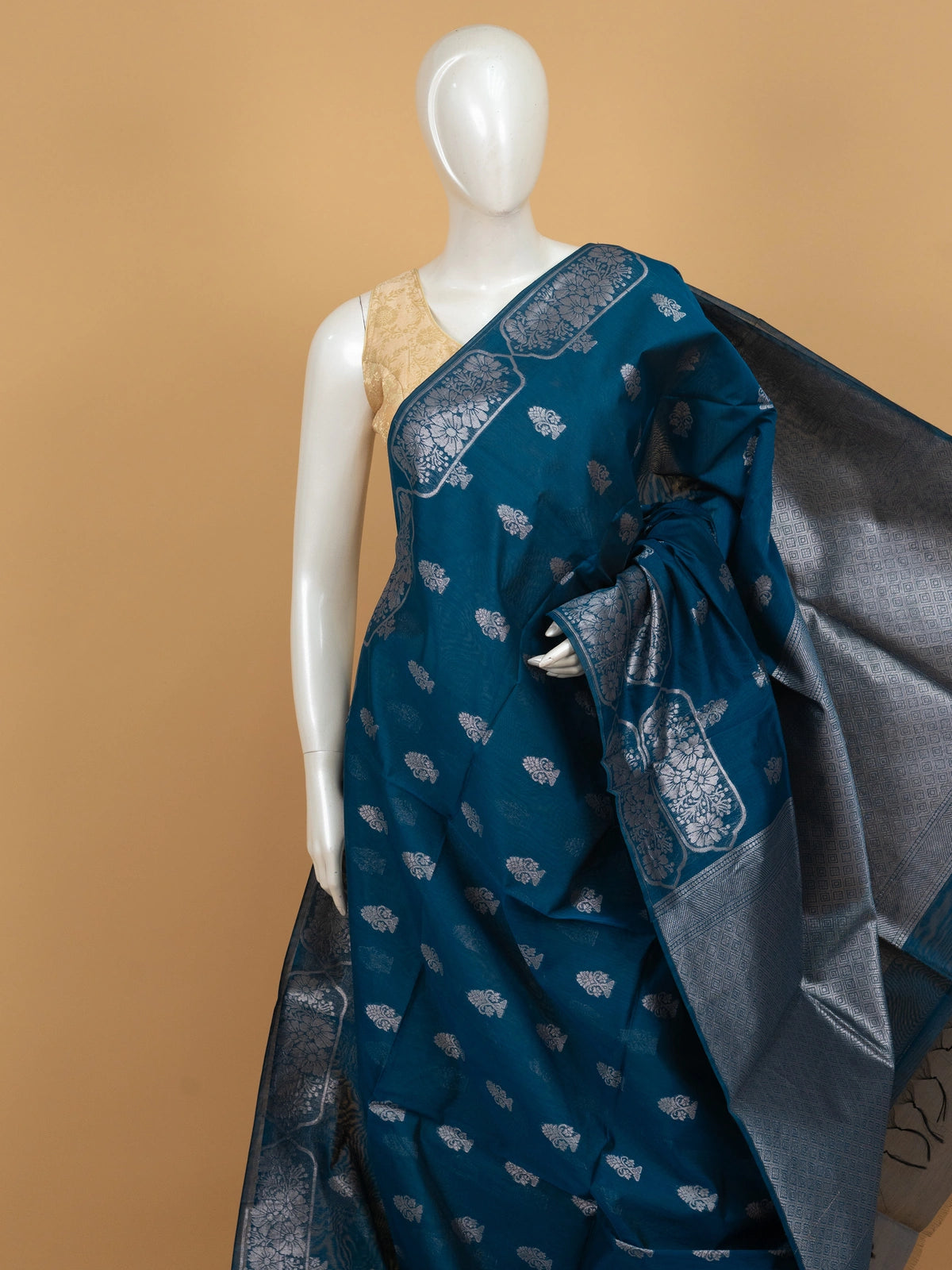 Peacock blue silk cotton saree with silver zari buttas and diamond-patterned zari border and pallu