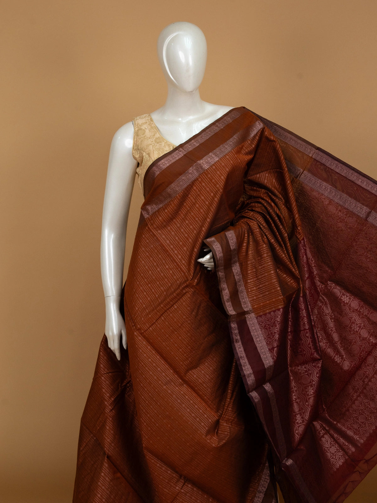 Rust brown silk cotton saree with contrast maroon zari border and woven pallu