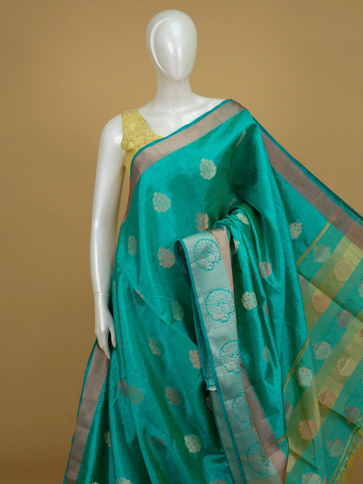 Teal green semi tussar saree with gold zari floral buttas and contrast zari border