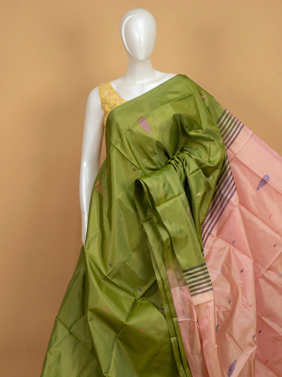 Olive green and peach Banana Silk saree with woven buttas and contrast striped pallu