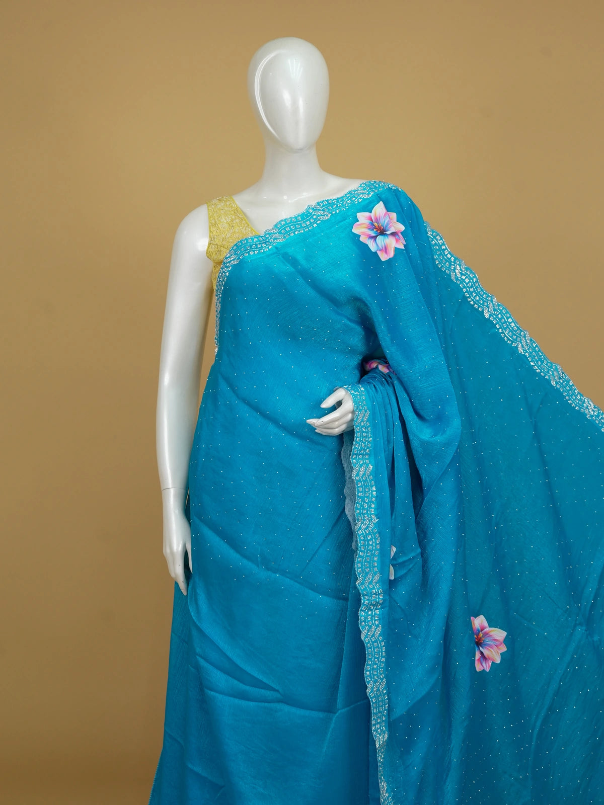 Teal blue designer art silk saree with multicolour floral prints and stone-work scalloped border