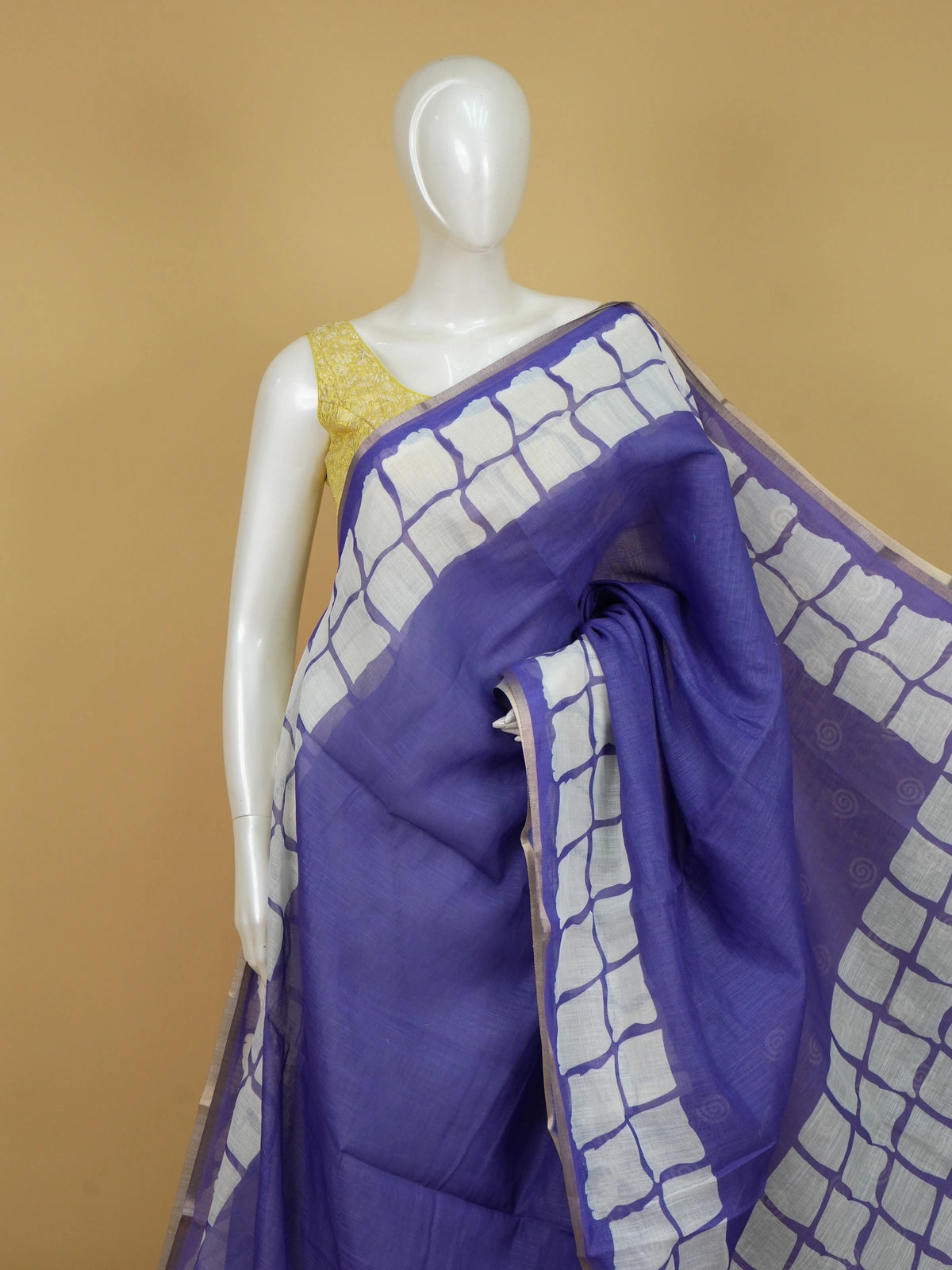 Violet linen cotton saree with white batik square-grid border and spiral motifs