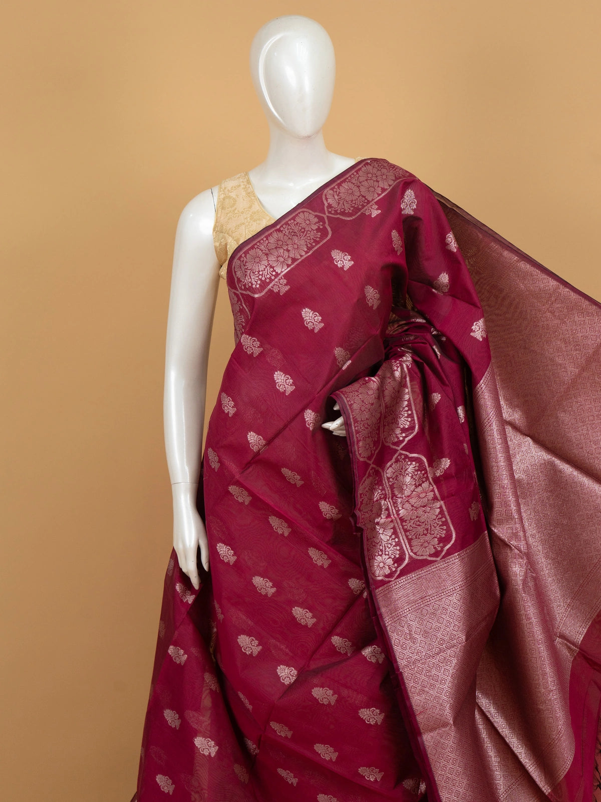 Magenta silk cotton saree with silver zari floral buttis and woven border