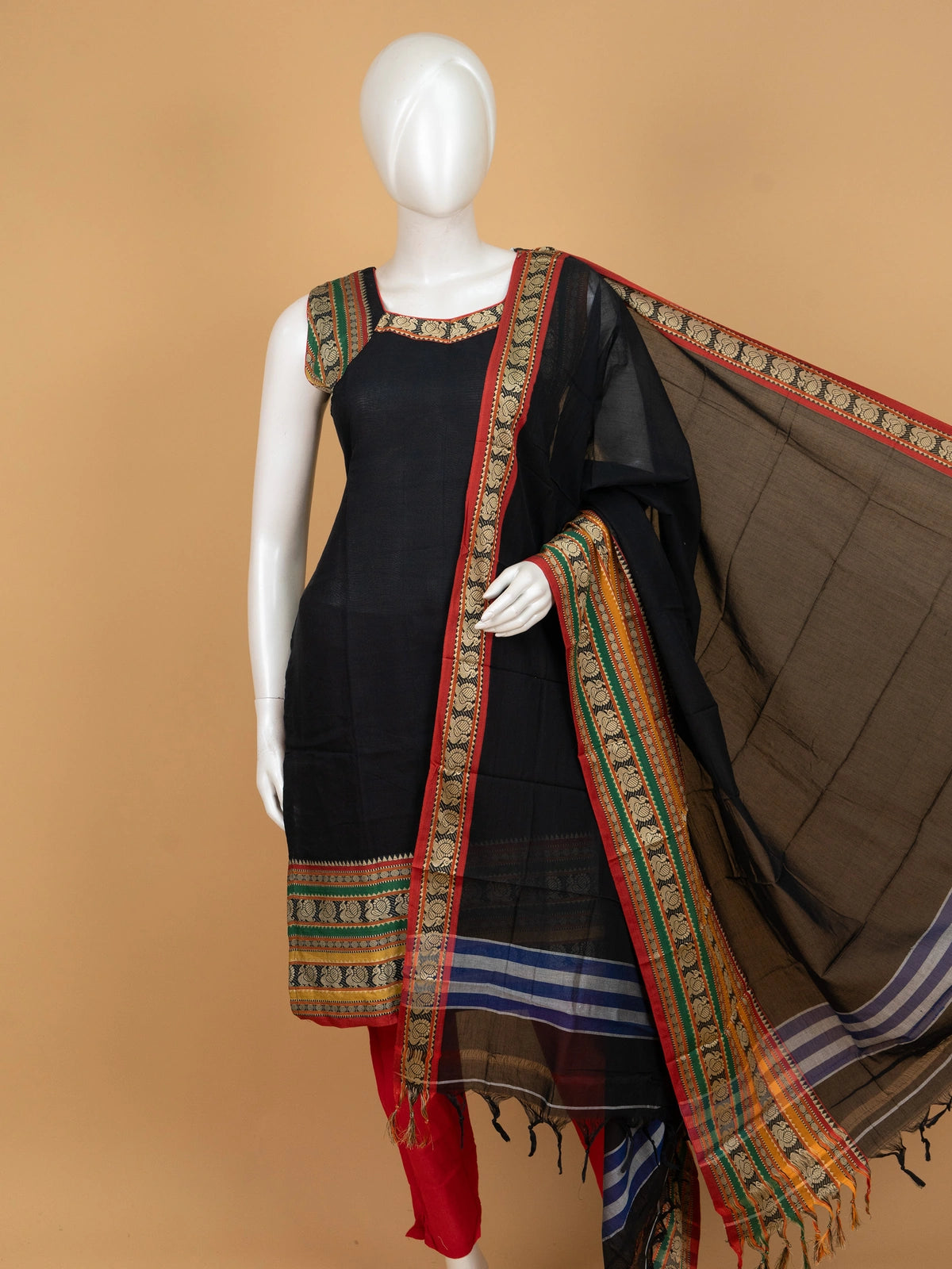 Black cotton straight cut kurti set with peacock woven borders, red pants and multicolour dupatta