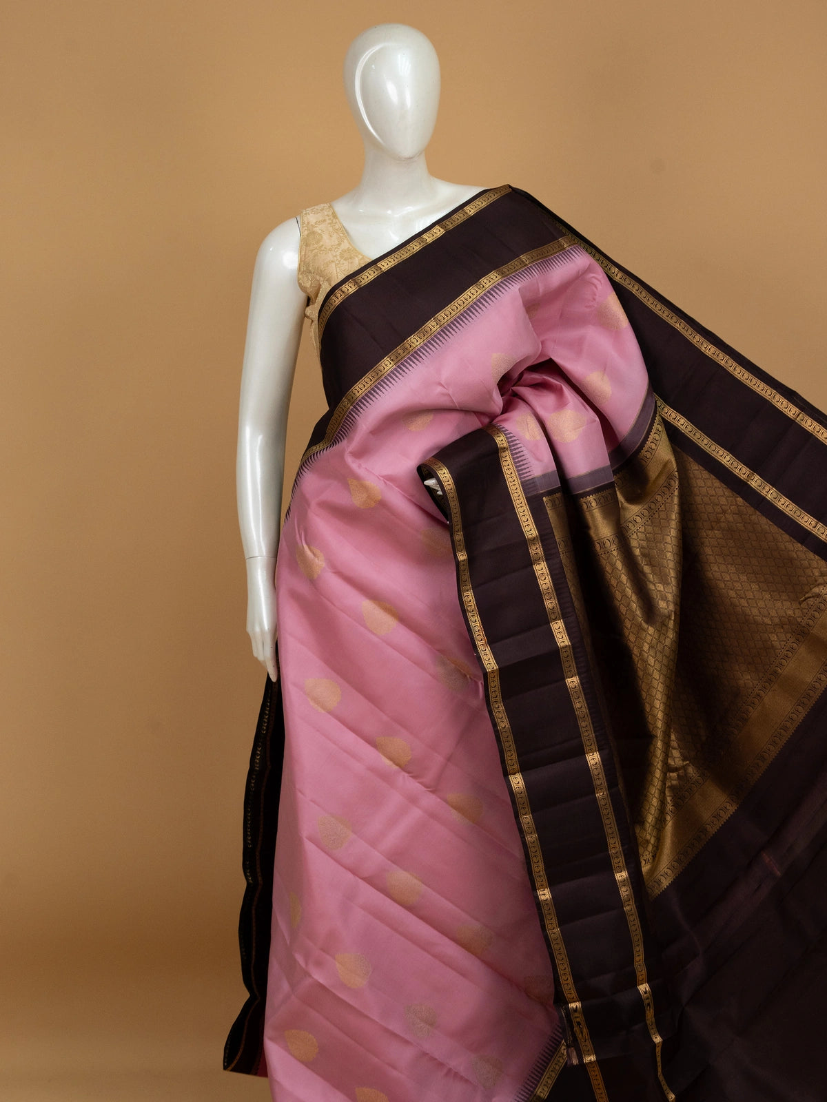 Pink pure Kanchipuram silk saree with contrast dark brown border and gold zari buti motifs