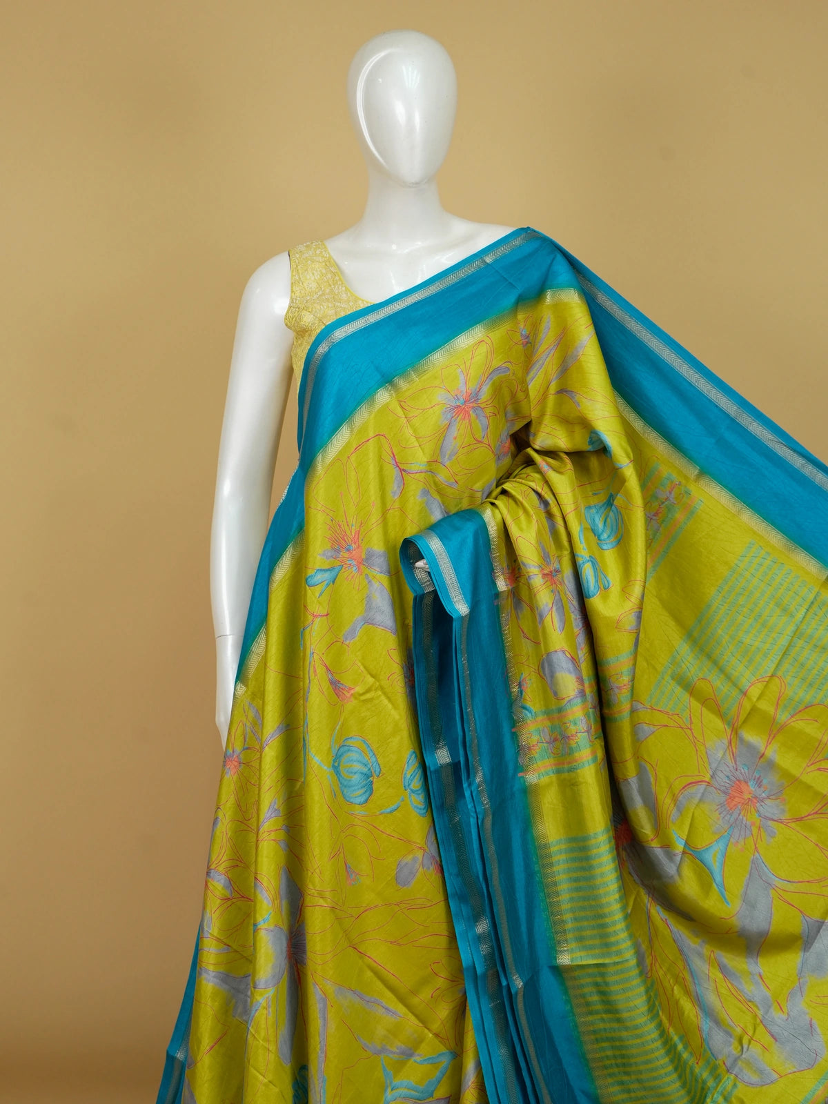 Lime green Dola silk saree with turquoise blue contrast border, silver zari and floral print