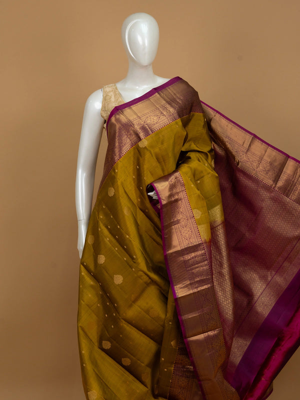 Mehendi green pure Kanchipuram silk saree with magenta contrast border and gold zari pallu