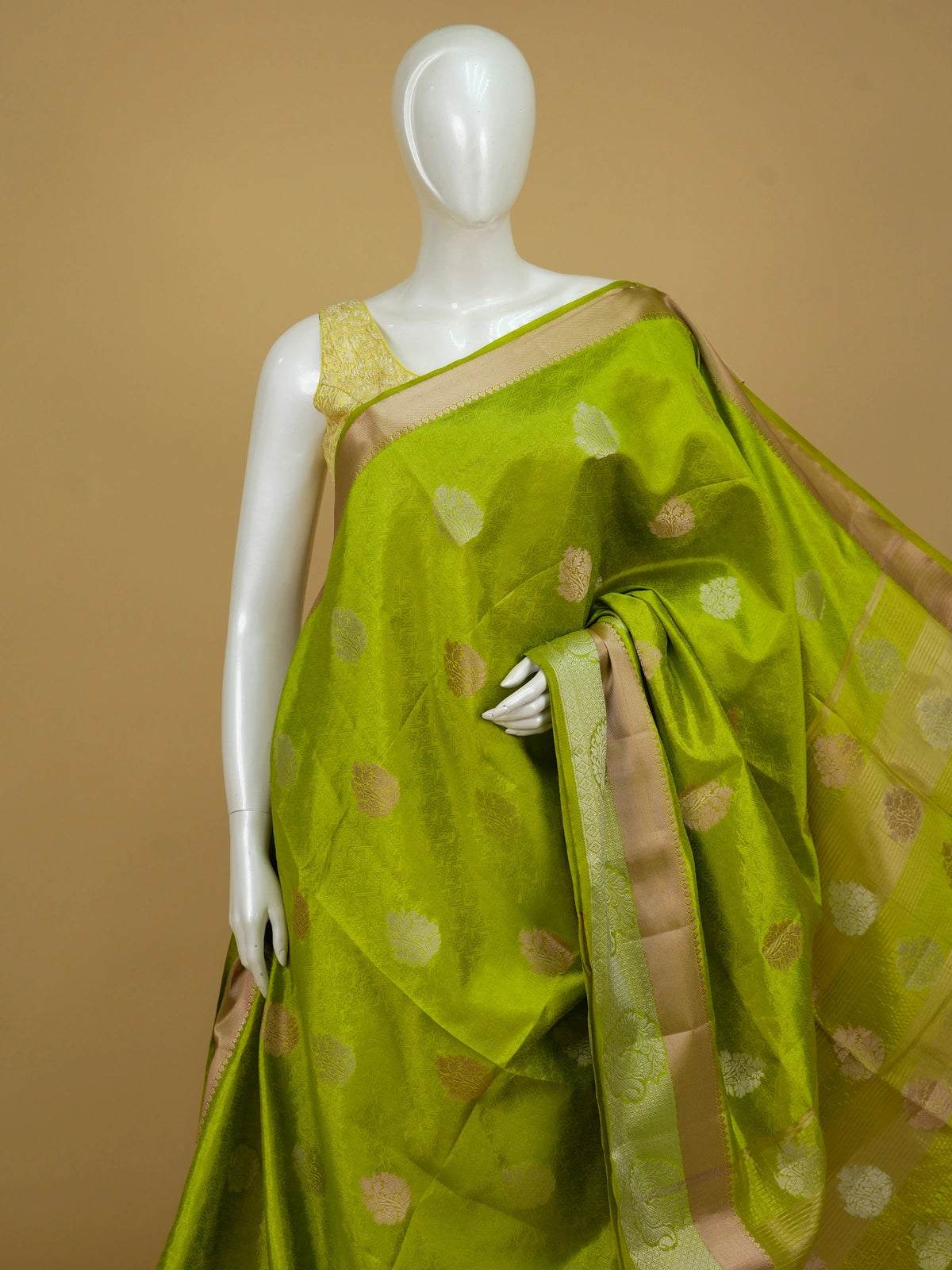Lime green semi tussar saree with gold and silver floral buttas and contrast beige-gold zari border