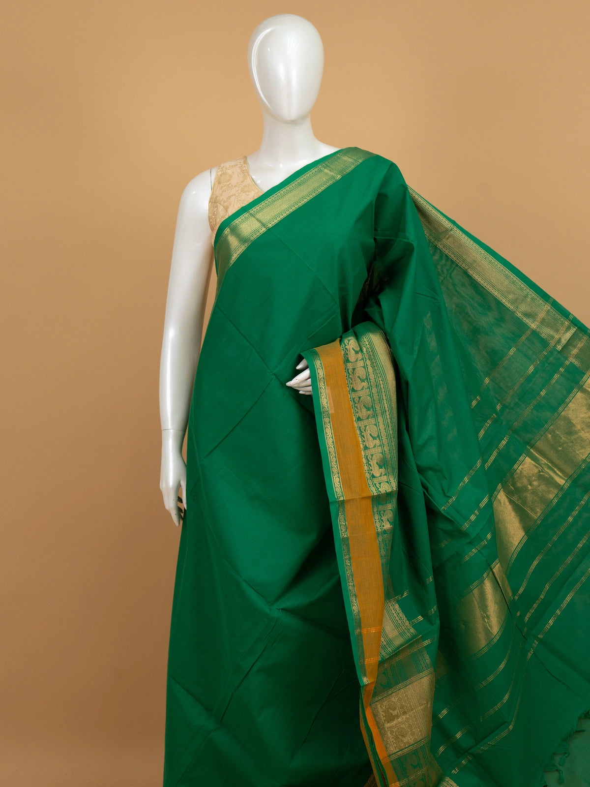 Green Chettinad cotton saree with gold zari peacock-motif border and striped pallu
