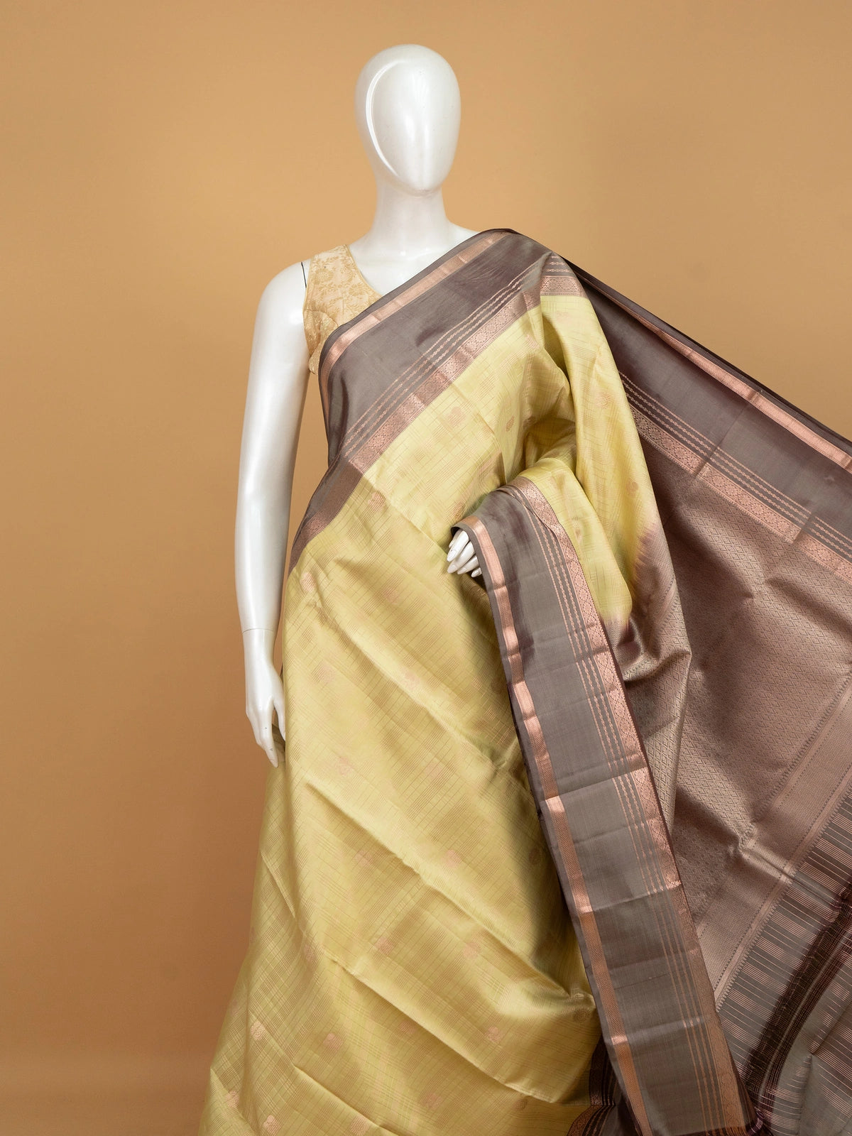Mehendi green pure Kanchipuram silk saree with grey-brown contrast border and copper zari pallu