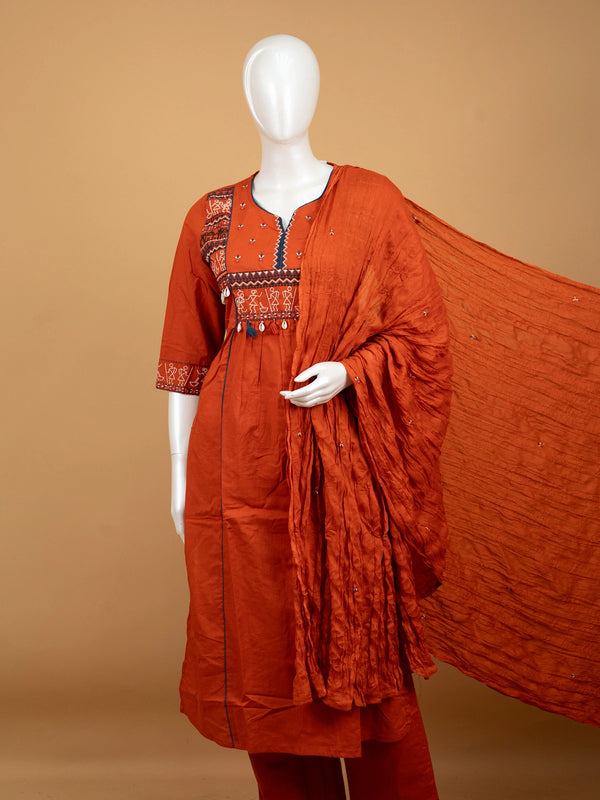 Rust orange cotton Warli embroidered Anarkali kurti set with cowrie shell tassels and matching dupatta