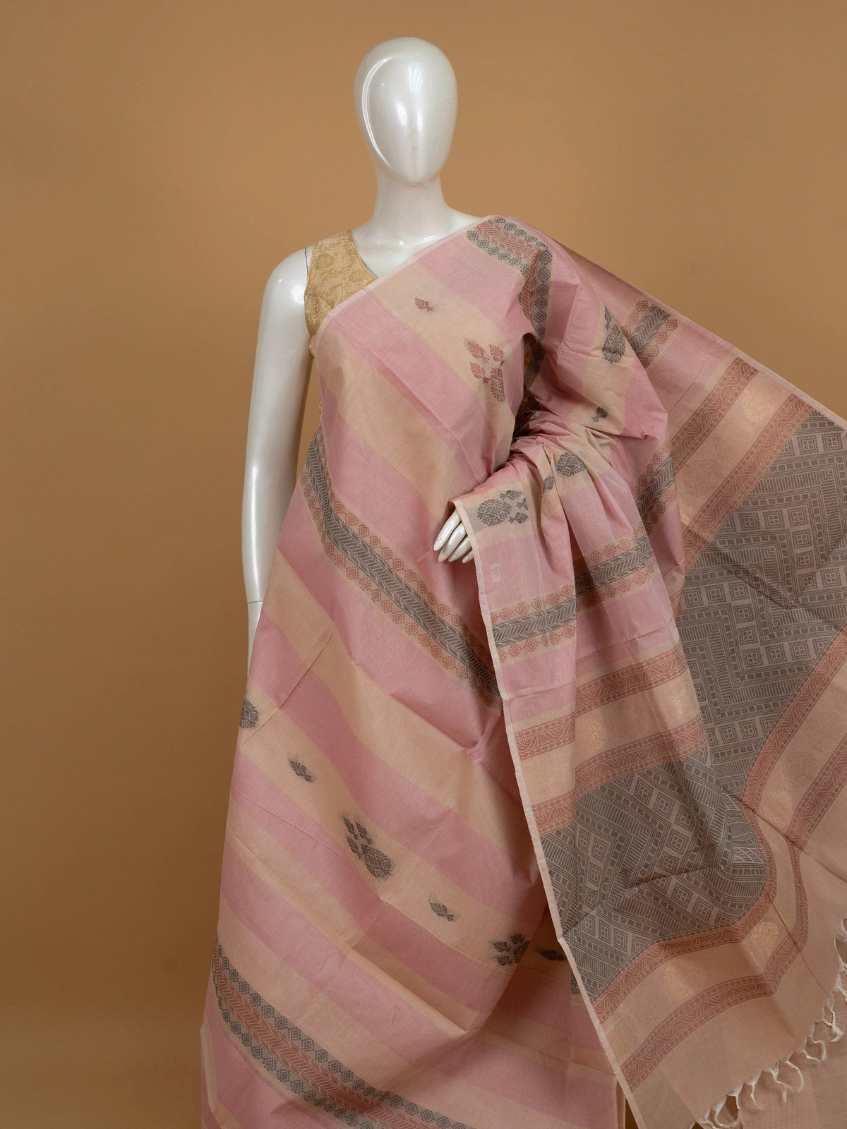Pink and beige silk cotton saree with striped body, floral buttas and contrast geometric woven border