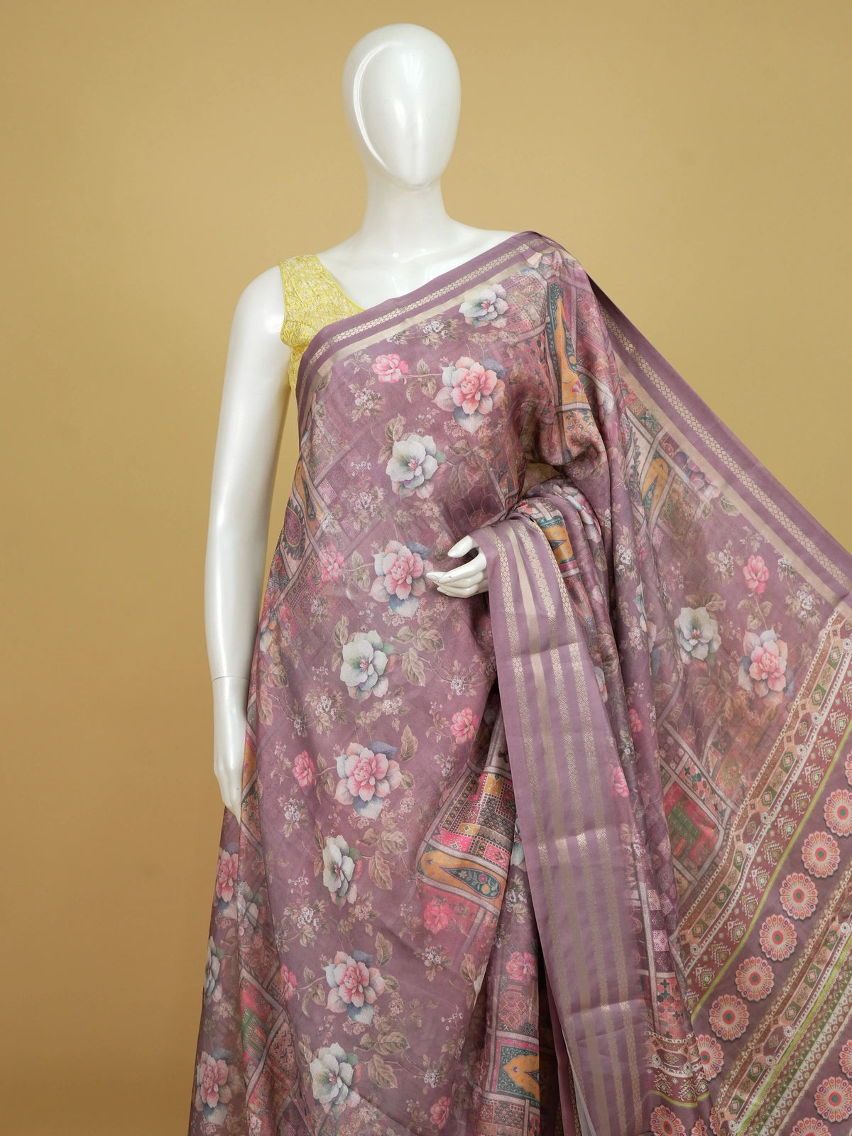 Dusty mauve floral printed designer saree with gold zari border and patchwork pallu