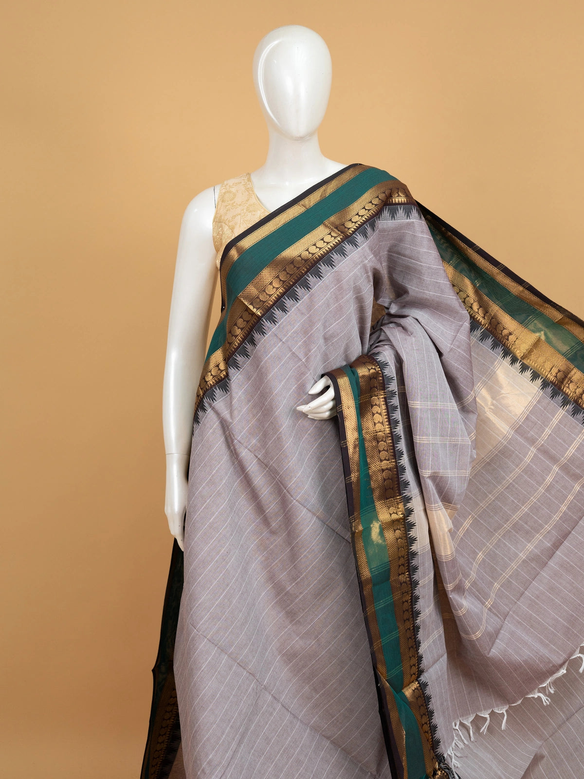 Grey Chettinad cotton saree with white checks and contrast green gold zari temple border