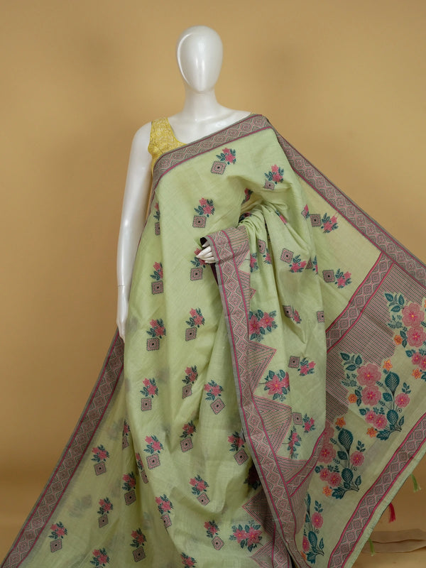 Pastel green linen cotton saree with pink floral print and geometric contrast border