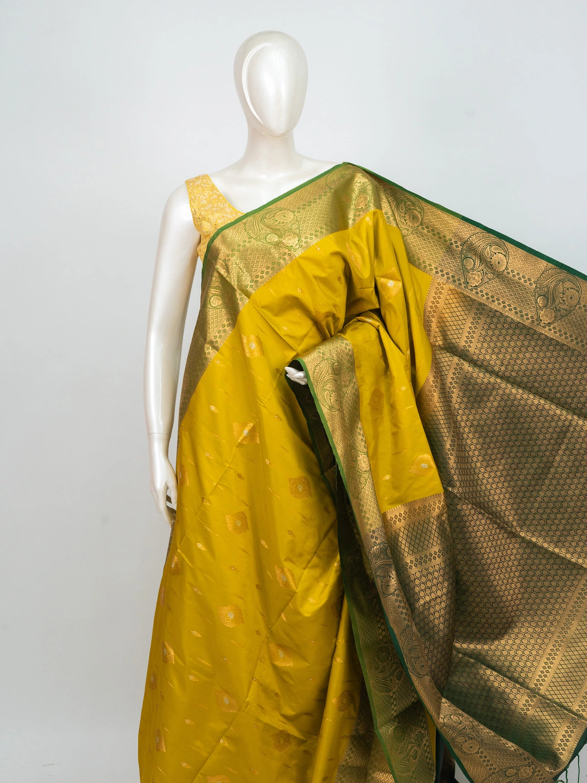 Yellow semi silk saree with contrast green and gold zari border and pallu
