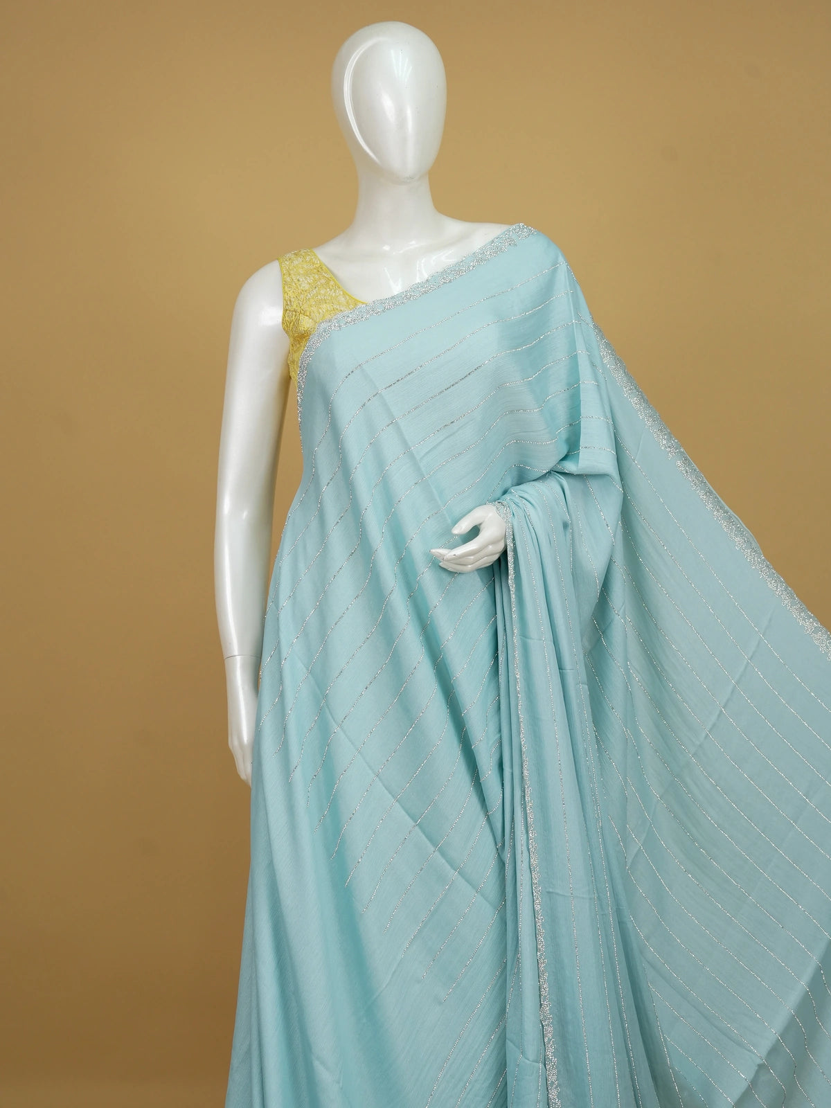 Sky blue designer georgette saree with silver sequin stripes and contrast yellow embroidered blouse