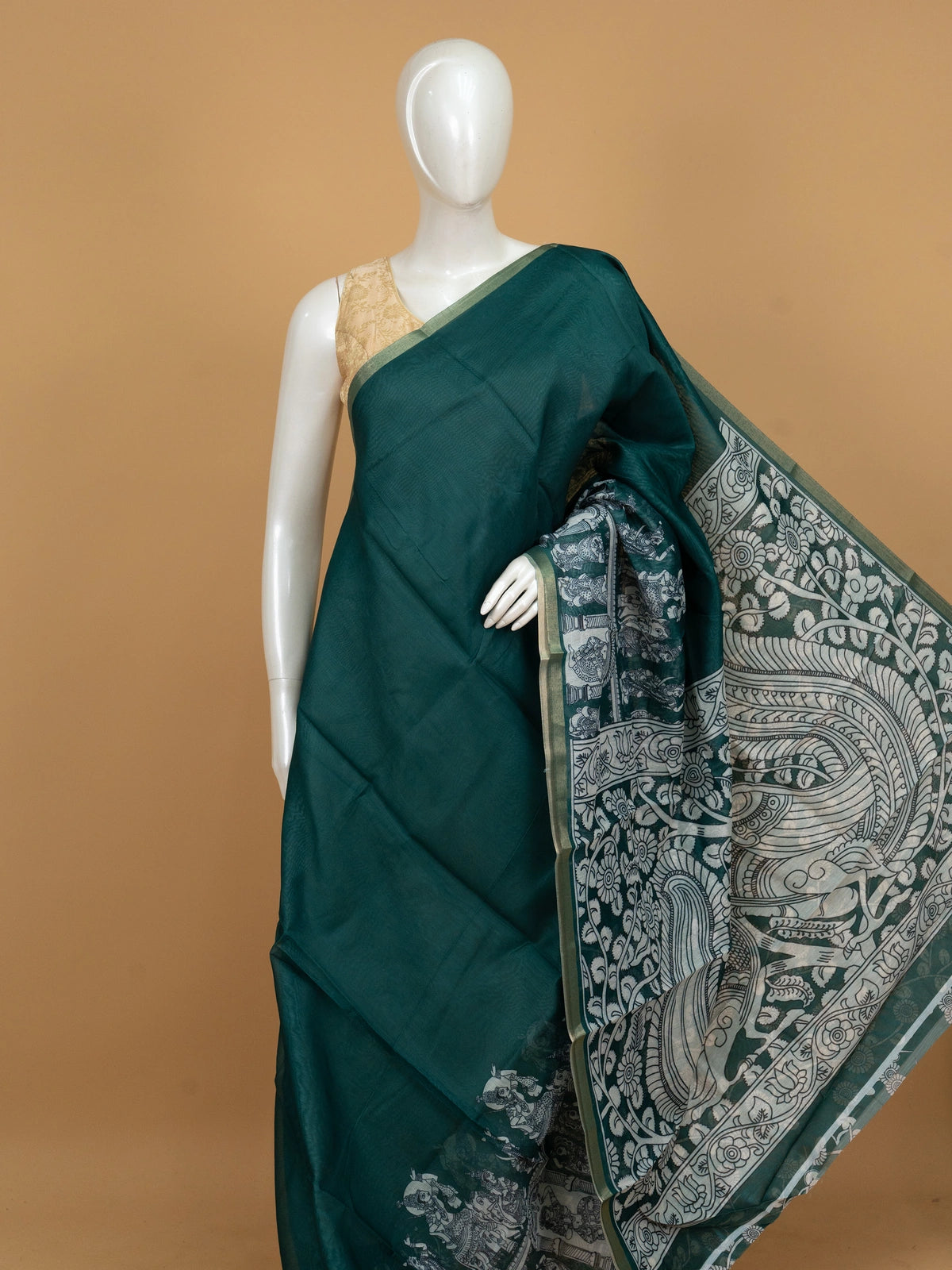 Teal green linen cotton saree with white kalamkari peacock and floral pallu and gold zari border