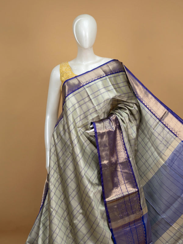 Sage green checked Kanchi semi silk saree with contrast violet gold zari border and pallu