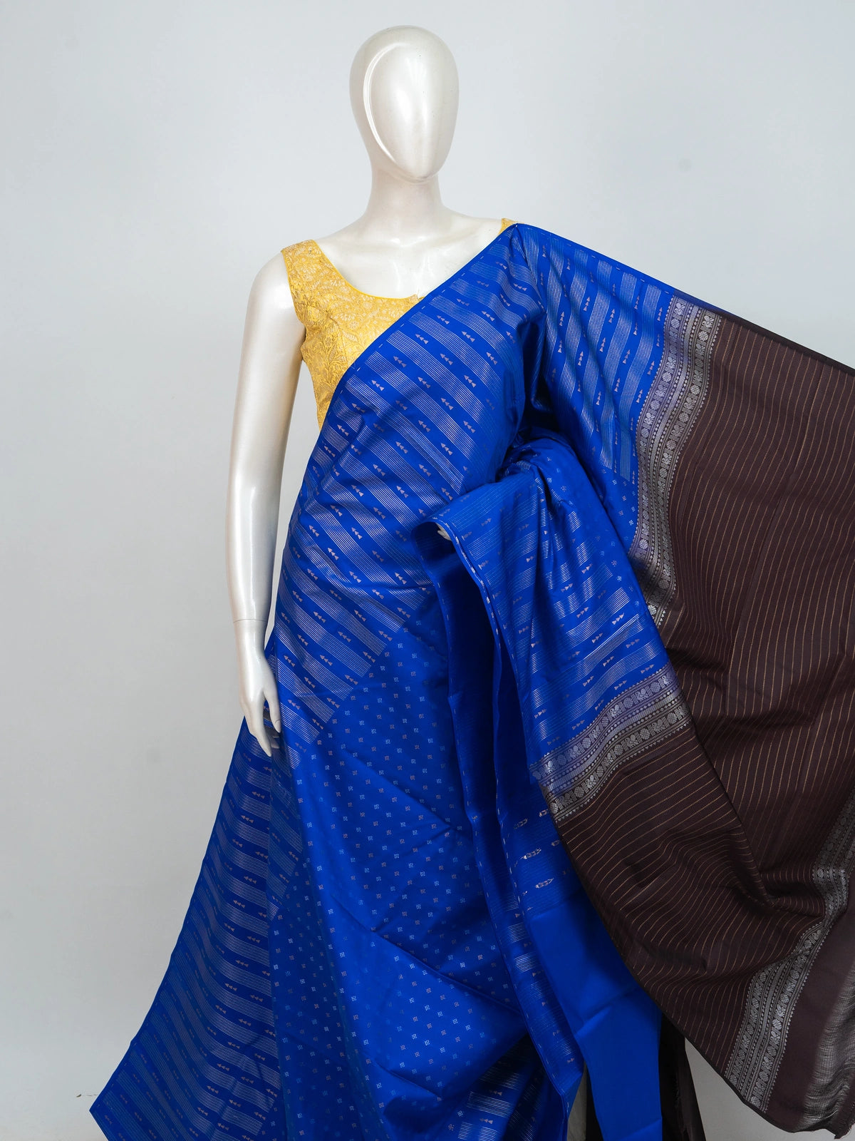 Royal blue semi silk saree with silver zari stripes and contrast dark brown border and pallu