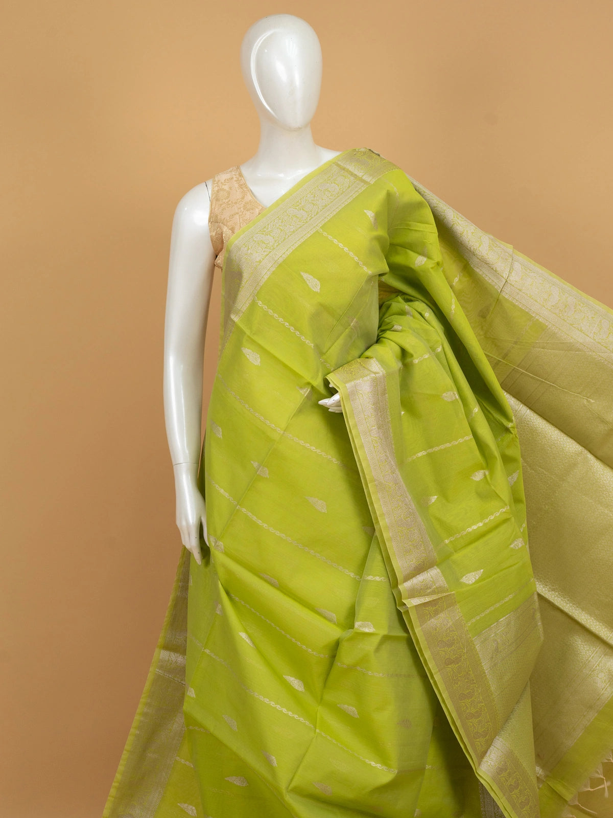 Lime green silk cotton saree with silver zari border and buttas